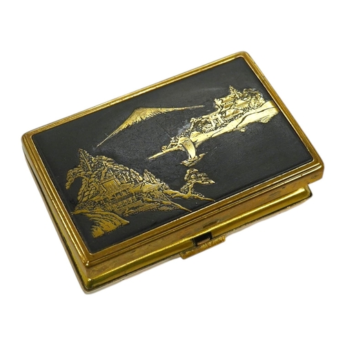 1455 - A Japanese damascened iron and gilt metal musical compact, 9cm wide. Condition - poor