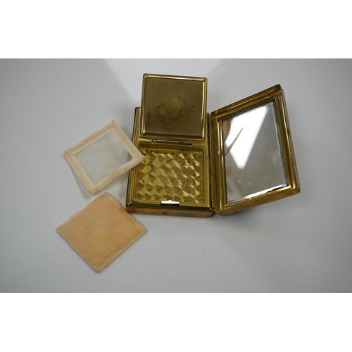 1455 - A Japanese damascened iron and gilt metal musical compact, 9cm wide. Condition - poor