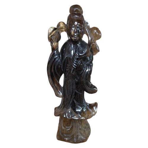 1459 - A 19th century Chinese smoky quartz figure of a lady holding a prunus branch, 19.5cm high. Condition... 