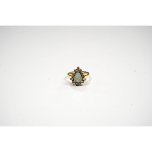 1941 - An 18k, white opal and round and baguette cut diamond set pear shaped cluster ring, size K/L, gross ... 