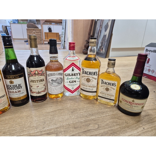 1410 - Nine bottles of spirits and two Sherry's. Condition - storage unknown