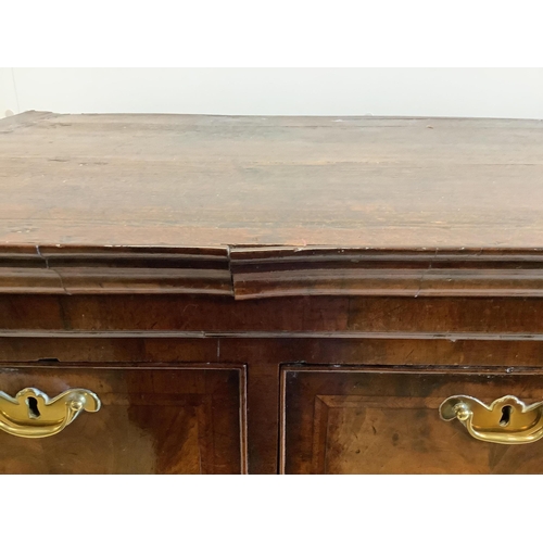 102 - A George II walnut chest on stand, width 104cm, depth 56cm, height 133cm. Condition - fair