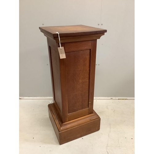 106 - An early 20th century oak pedestal, width 37cm, height 90cm. Condition - fair