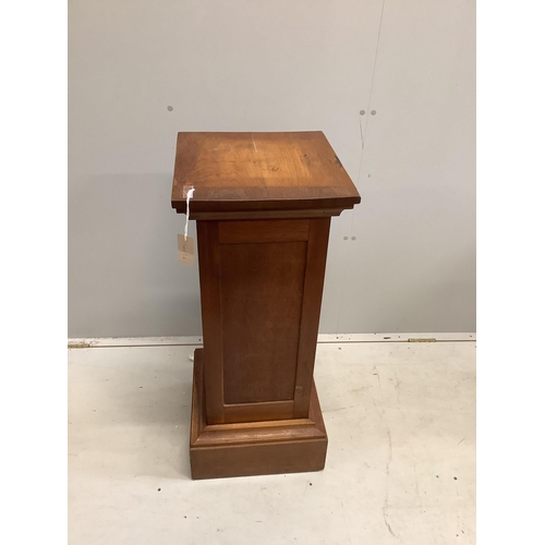 106 - An early 20th century oak pedestal, width 37cm, height 90cm. Condition - fair