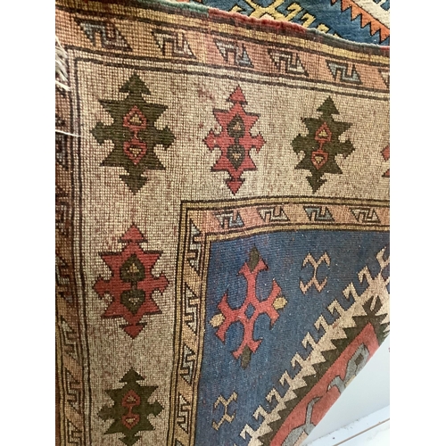 2 - A Caucasian style blue ground rug, 260 x 160cm. Condition - fair