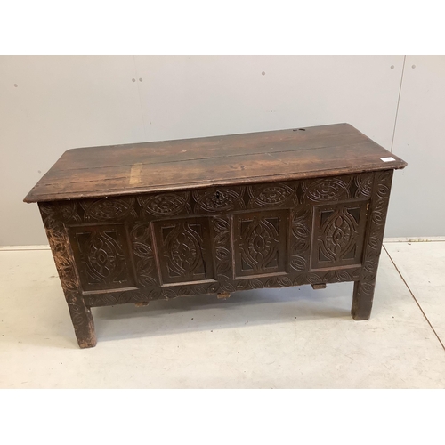 23 - An 18th century carved oak coffer, width 125cm, depth 53cm, height 68cm. Condition - poor