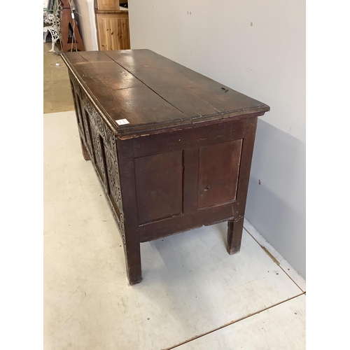 23 - An 18th century carved oak coffer, width 125cm, depth 53cm, height 68cm. Condition - poor