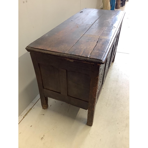 23 - An 18th century carved oak coffer, width 125cm, depth 53cm, height 68cm. Condition - poor