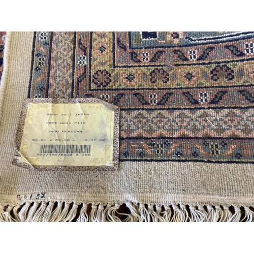 27 - A pair of North West Persian ivory ground carpets, each 294 x 299cm. Condition - fair