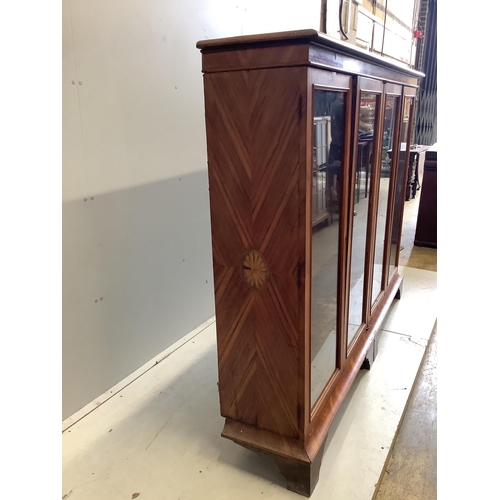 3 - A large 19th century glazed kingwood bookcase, fitted four hinged doors and three adjustable shelves... 