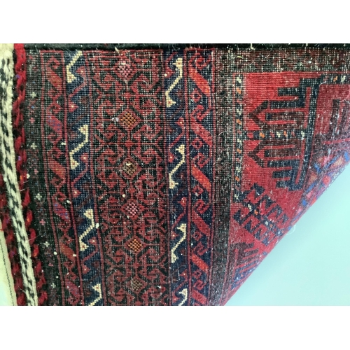 31 - An Afghan rug, 164 x 82cm. Condition - fair