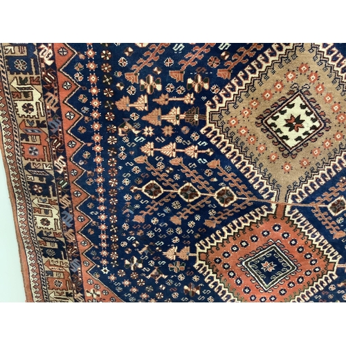 42 - A North West Persian Yalameh blue ground rug, 226 x 151cm. Condition - fair