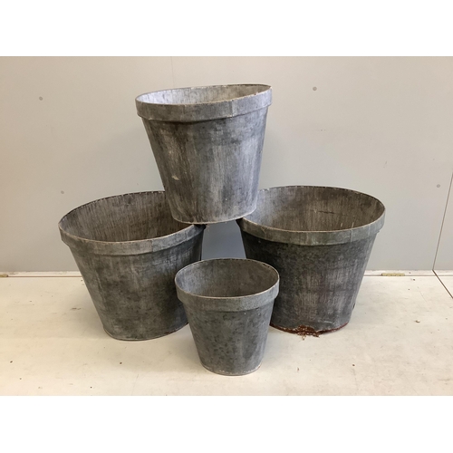 51 - A graduated set of four oval zinc containers, largest width 56cm, height 50cm. Condition - poor to f... 