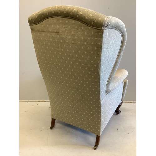 57 - An early 20th century upholstered wing armchair, width 80cm, depth 80cm, height 124cm. Condition - f... 