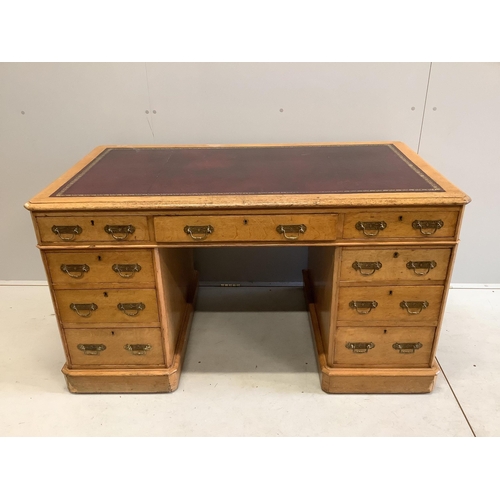 61 - A Victorian golden oak pedestal desk, stamped E Buckham, width 136cm, depth 74cm, height 76cm. Condi... 