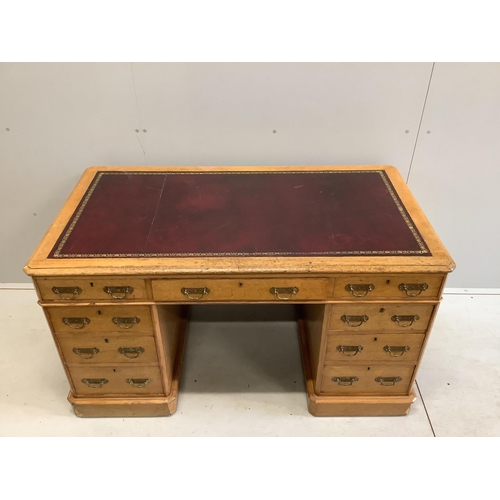 61 - A Victorian golden oak pedestal desk, stamped E Buckham, width 136cm, depth 74cm, height 76cm. Condi... 