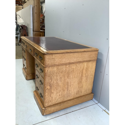 61 - A Victorian golden oak pedestal desk, stamped E Buckham, width 136cm, depth 74cm, height 76cm. Condi... 