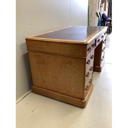 61 - A Victorian golden oak pedestal desk, stamped E Buckham, width 136cm, depth 74cm, height 76cm. Condi... 