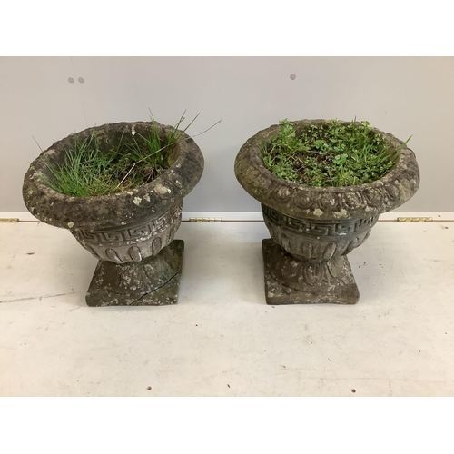 7 - A pair of reconstituted stone circular campana garden urns, diameter 40cm, height 38cm. Condition - ... 