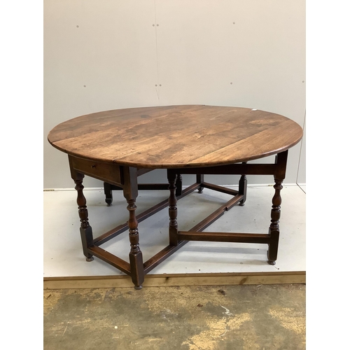 70 - An 18th century mahogany gateleg dining table, 145cm extended, depth 144cm, height 74cm. Condition -... 