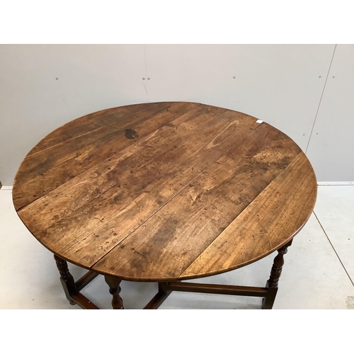 70 - An 18th century mahogany gateleg dining table, 145cm extended, depth 144cm, height 74cm. Condition -... 