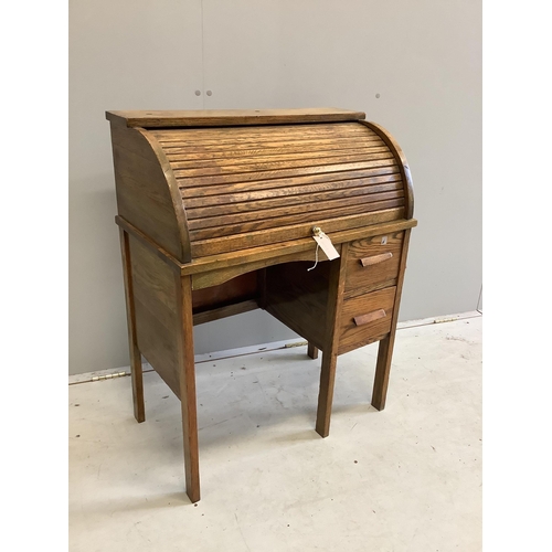 94 - A small early 20th century oak roll top tambour shutter writing desk, width 68cm, depth 38cm, height... 