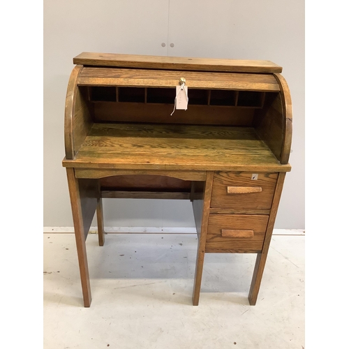 94 - A small early 20th century oak roll top tambour shutter writing desk, width 68cm, depth 38cm, height... 