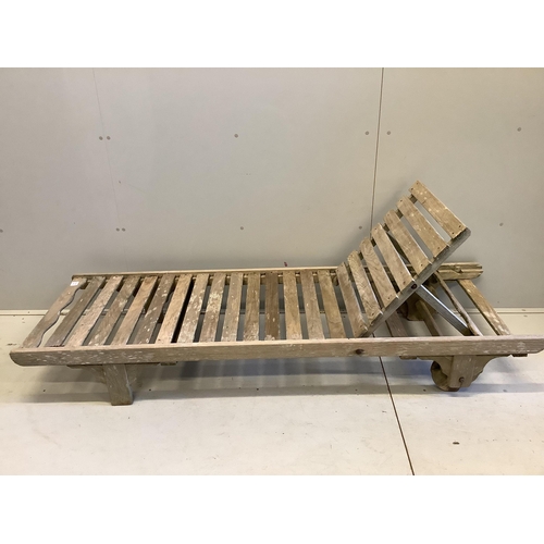 95 - A weathered teak lounger, possibly Lister, width 64cm, length 195cm. Condition - poor