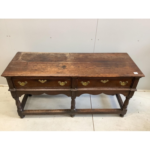 98 - An 18th century oak low dresser base with two long drawers, width 150cm, depth 53cm, height 77cm. Co... 