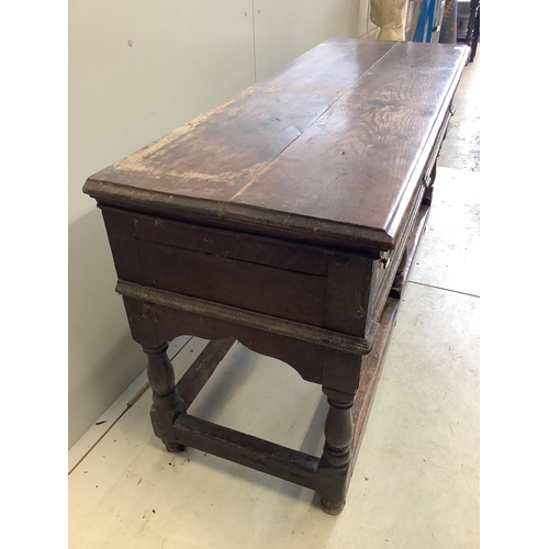 98 - An 18th century oak low dresser base with two long drawers, width 150cm, depth 53cm, height 77cm. Co... 