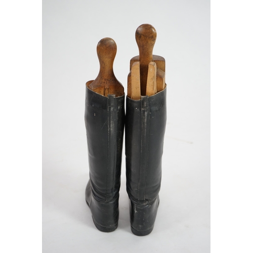 12 - A pair of black leather riding boots with wooden tree liners, overall 61cm high