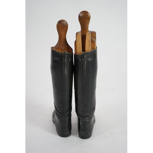 12 - A pair of black leather riding boots with wooden tree liners, overall 61cm high