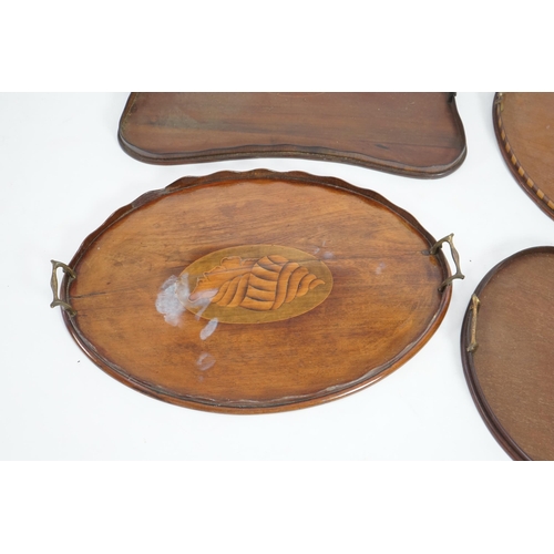 14 - Four Edwardian inlaid mahogany gallery trays, two of kidney shape, one serpentine rectangular, the o... 