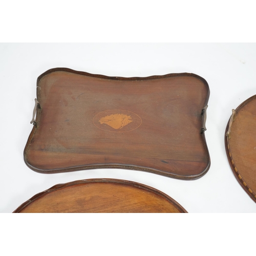 14 - Four Edwardian inlaid mahogany gallery trays, two of kidney shape, one serpentine rectangular, the o... 