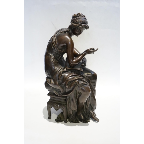 23 - A 19th century French bronze figure of Sappho seated, holding a book and stylus, 34cm high