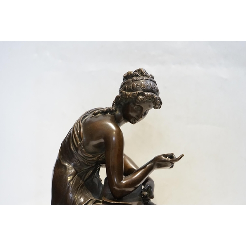 23 - A 19th century French bronze figure of Sappho seated, holding a book and stylus, 34cm high