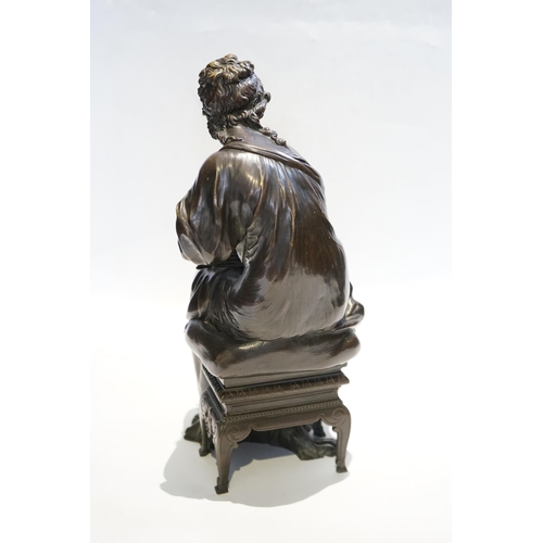 23 - A 19th century French bronze figure of Sappho seated, holding a book and stylus, 34cm high