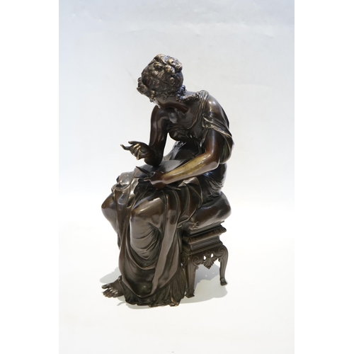 23 - A 19th century French bronze figure of Sappho seated, holding a book and stylus, 34cm high