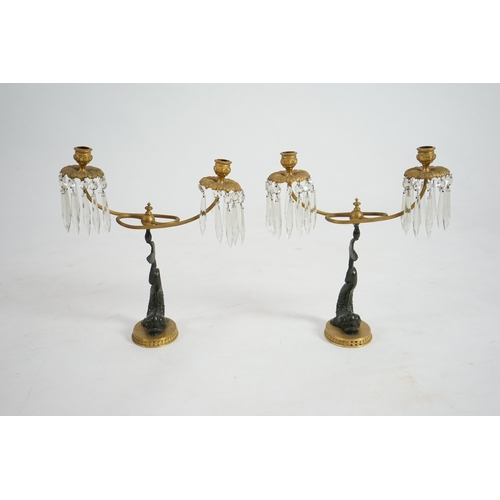 25 - A pair of 19th century bronze and ormolu twin sconce candelabra with cut glass icicle drops, reeded ... 