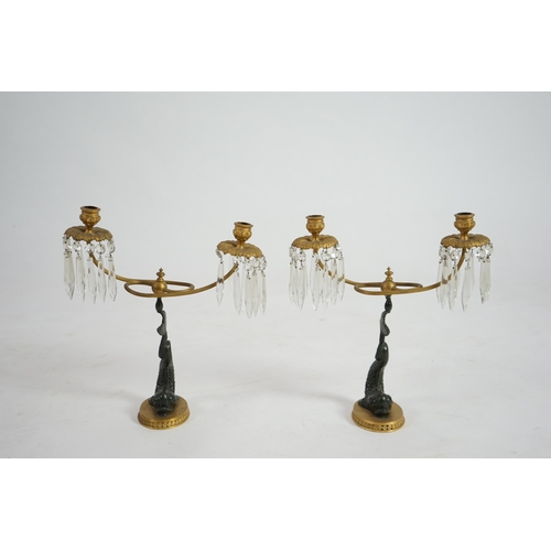 25 - A pair of 19th century bronze and ormolu twin sconce candelabra with cut glass icicle drops, reeded ... 