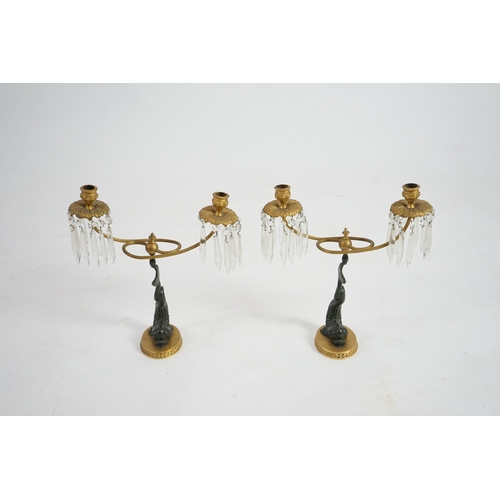 25 - A pair of 19th century bronze and ormolu twin sconce candelabra with cut glass icicle drops, reeded ... 