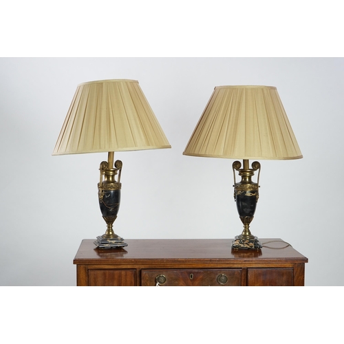 37 - A pair of French Empire style ormolu mounted black marble table lamps decorated with classical motif... 