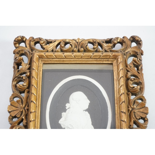 6 - A Tassie style plaster relief of George III, housed in a gilt scroll frame, the relief 7cm, frame 24... 