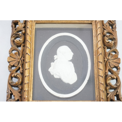 6 - A Tassie style plaster relief of George III, housed in a gilt scroll frame, the relief 7cm, frame 24... 