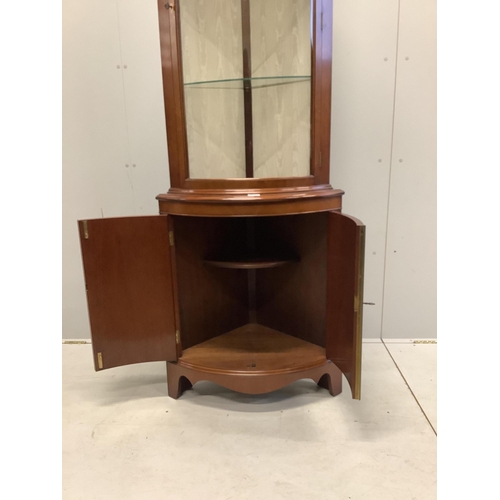 1004 - A reproduction Sheraton style inlaid mahogany bow fronted standing corner cupboard, width 70cm, dept... 