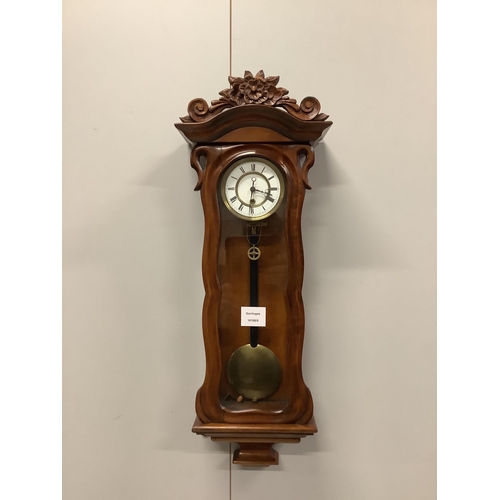 1010 - A small late 19th century carved glazed mahogany eight day Vienna style wall clock, height 64cm. Con... 