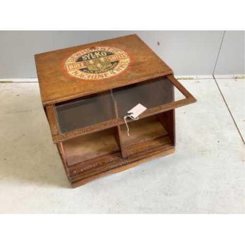 1021 - An early 20th century oak counter top display case, 'Dewhursts Sylko three shells machine twist' on ... 