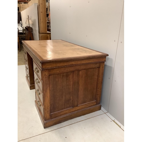 1023 - An early 20th century oak pedestal desk, bears George V cypher and stamped John Walsh Ltd Sheffield,... 