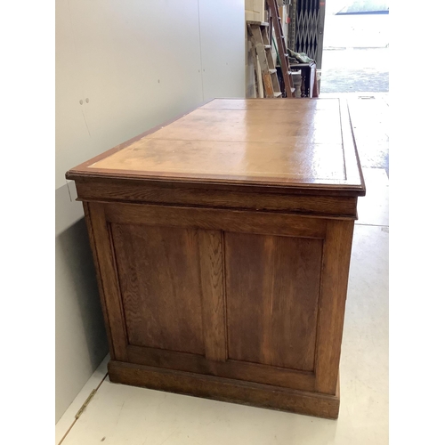 1023 - An early 20th century oak pedestal desk, bears George V cypher and stamped John Walsh Ltd Sheffield,... 