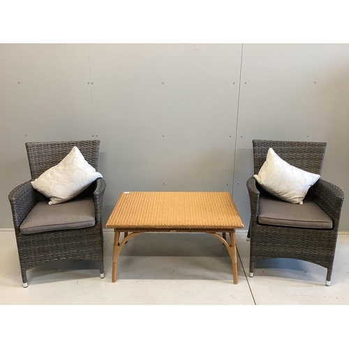 1034 - A pair of all weather rattan garden chairs with cushions, width 63cm, depth 56cm, height 90cm togeth... 